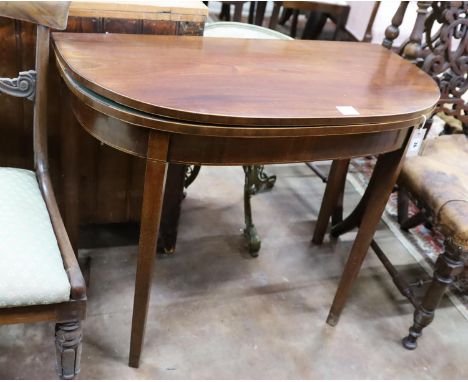 A George III inlaid mahogany D shaped folding card table, width 91cm, depth 45cm, height 74cm