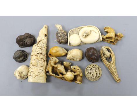 A collection of Japanese ivory and wood netsuke and okimono