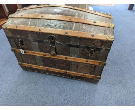 A Victorian leather bound dome top trunk, length 88cm, depth 50cm, height 60cm