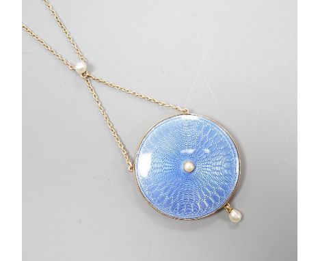 An Edwardian yellow metal, blue guilloche enamel and seed pearl set pendant necklace, pendant, 28mm, overall approx. 48cm, gr