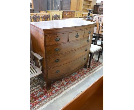 A Georgian mahogany bow fronted chest, fitted three short drawers and three long drawers on splayed bracket feet, width 115cm