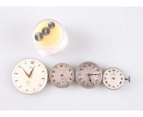 ROLEX WATCH PARTS comprising THREE ROLEX DIALS AND MOVEMENTS; A ROLEX OYSTER DIAL AND MOVEMENT; and THREE ROLEX WINDING WHEEL