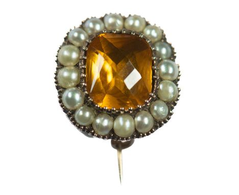 A MID-19TH CENTURY CITRINE AND SPLIT PEARL BROOCH a cushion-cut citrine in a closed-back setting, within a border of split pe