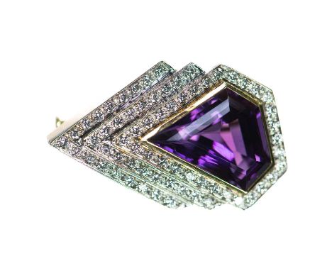 AN AMETHYST AND DIAMOND BROOCH a kite-cut amethyst within a conforming stepped border of round brilliant-cut diamonds. Estima