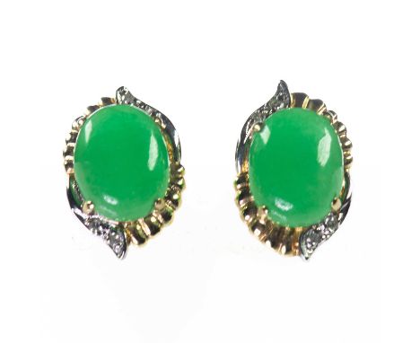 A PAIR OF BI-COLOUR JADE AND DIAMOND EARRINGS oval jade within bi-colour fancy frames with diamond accents, with post fitting