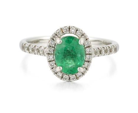 A PLATINUM EMERALD AND DIAMOND CLUSTER RING an oval-cut emerald within a border of round brilliant-cut diamonds, to diamond-s