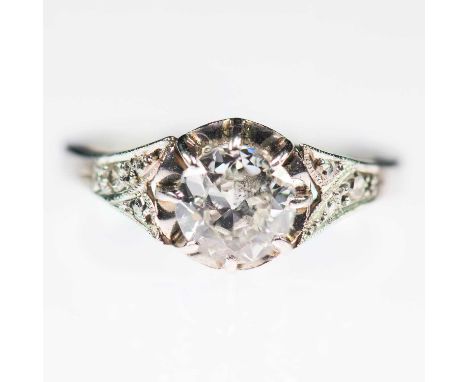 AN EARLY 20TH CENTURY SOLITAIRE OLD-CUT DIAMOND RING an old-cut diamond in an extended claw setting to fancy milgrain diamond