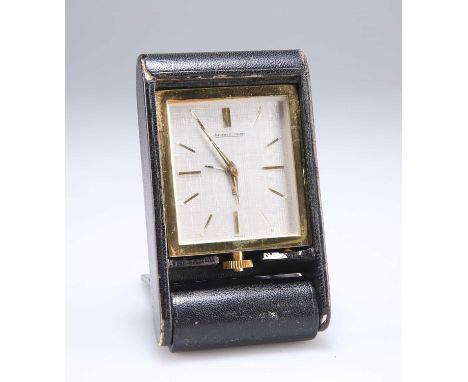 A JAEGER LECOULTRE BRASS 8-DAY TRAVEL ALARM CLOCK the brushed silvered rectangular dial with gilt batons, signed Jaeger LeCou