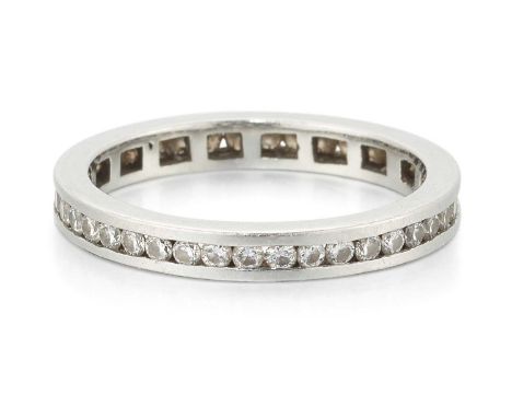 A DIAMOND ETERNITY RING channel-set round brilliant-cut diamonds to a plain band. Estimated total diamond weight 0.30ct, unma