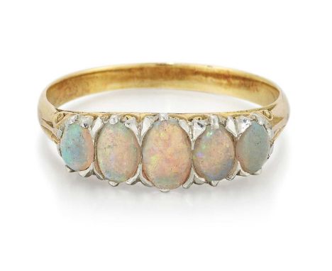 AN OPAL FIVE STONE RING graduated oval opals in a carved setting. Unmarked, ring size O, 2.0 gramsSome abrasion and dullness 