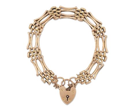 A VICTORIAN FANCY GATE LINK BRACELET of fancy engraved brick links and double bar links, to a heart-shaped padlock clasp. Mar