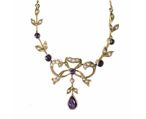 MURRLE BENNETT &amp; CO - AN EARLY 20TH CENTURY AMETHYST AND SEED PEARL PENDANT NECKLACE a ribbon bow flanked by laurel leaf 