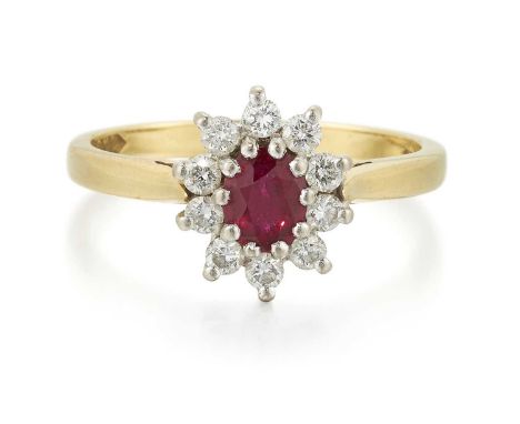 AN 18 CARAT GOLD RUBY AND DIAMOND CLUSTER RING an oval-cut ruby in a claw setting within a border of round brilliant-cut diam