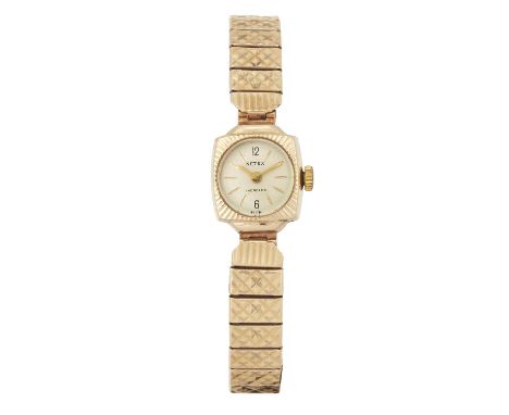 A LADY'S 9 CARAT GOLD NETEX BRACELET WATCH the circular champagne dial with baton indices and Arabic numerals at 6/12 o'clock