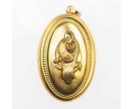 A VICTORIAN LOCKET PENDANT the oval locket with a central garter motif, within a beaded frame. Unmarked, 4.2cm by 2.4cm, 9.2 