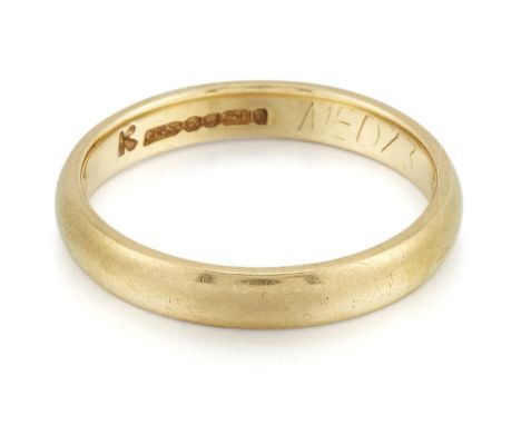 AN 18 CARAT GOLD BAND RING hallmarked Sheffield 1980, ring size K, 3.0 gramsLight general wear.