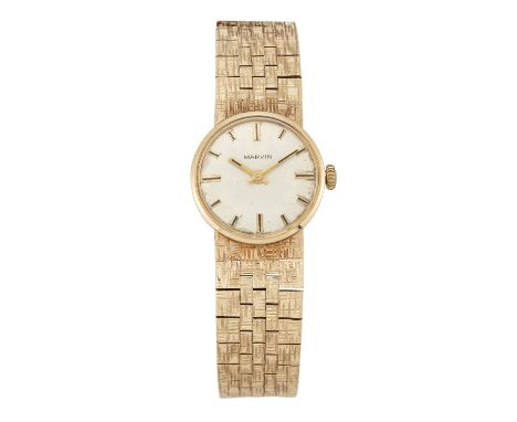 A LADY'S 9 CARAT GOLD MARVIN BRACELET WATCH the circular silver dial signed Marvin with gilt baton index and gilt/black hands