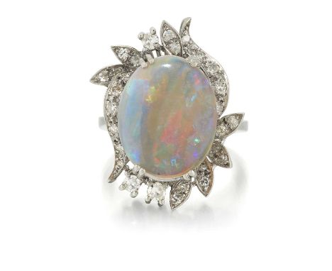 A 14 CARAT WHITE GOLD OPAL AND DIAMOND CLUSTER RING an oval opal within a diamond-set leaf scroll frame. Estimated total diam