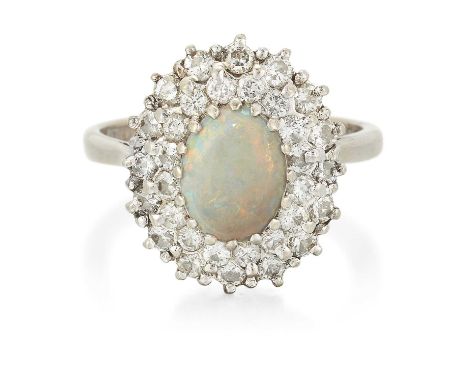 AN 18 CARAT WHITE GOLD OPAL AND DIAMOND CLUSTER RING an oval opal within a double border of round brilliant-cut diamonds. Est