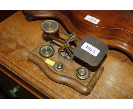 A set of postage scales and weights