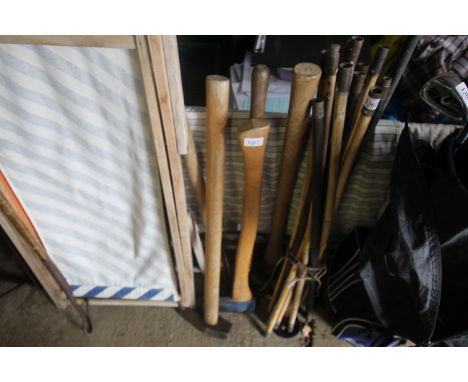 A splitting axe, a felling axe, edging shears and a pick axe