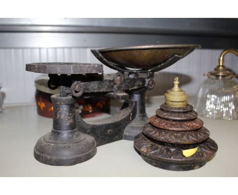 A set of cast iron kitchen scales and weights etc.