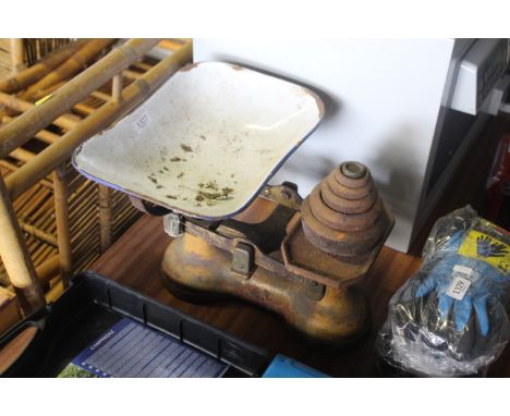 A set of balance scales with weights