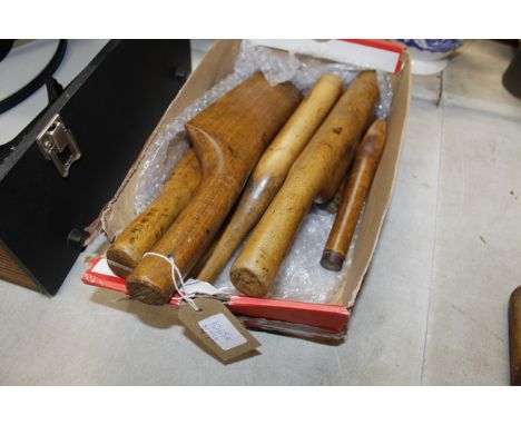 A box of wooden lead beaters tools