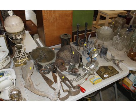 A collection of metal ware to include Corinthian column table lamp, set of scales, British WWII tin helmet, brass desk stand,