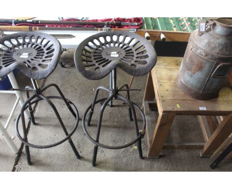 A tractor seat stool (85)