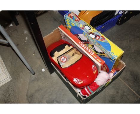A Barbie toy car, various other toys, and a board game