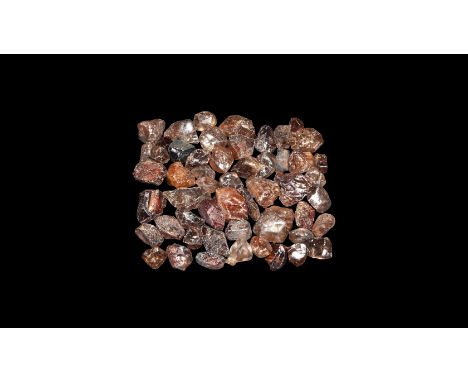 A group of fine small sixty-two zircon specimens from Nigeria.  33 grams total, 5-12mm (1/4 - 1/2"). From a historic ‘Victori