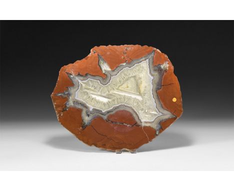 A fine cut and polished agate slice with brown and blue bands, and honeycomb crystal formation to the centre.  734 grams, 27c