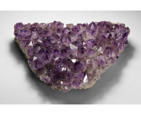 A large sheet with richly coloured amethyst crystals with black anatase speckles layered over rock crystal.  5.2 kg, 29.5cm (