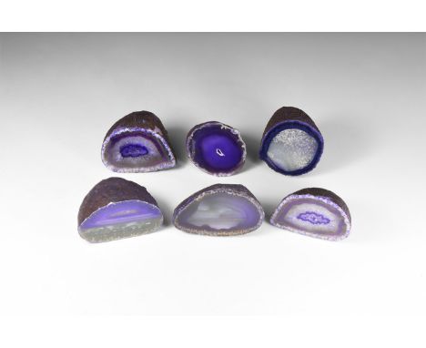 A group of six cut and polished purple agate nodules, colour enhanced.  1.14 kg total, 60-76mm (2 1/4 - 3"). From a historic 