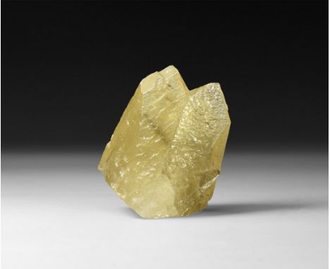 A pale yellow calcite crystal with two points and waxy sheen.  180 grams, 70mm (2 3/4"). From the historic ‘Victorian Museum’