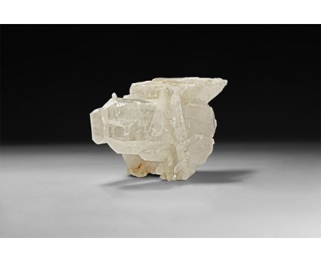 A fine display specimen of quartz, comprising three large and numerous smaller transparent to slightly milky crystals on a ba