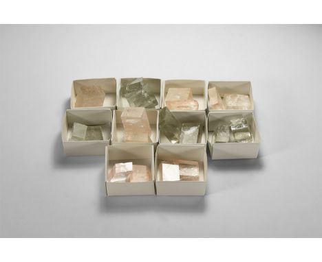 A group of twenty-one transparent and pale pink crystals with rainbow reflections, supplied with ten card trays.  218 grams t