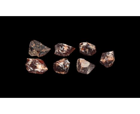 A group of seven dark red hessonite garnets.  19 grams total, 15-17mm (3/4"). From a historic ‘Victorian Museum’ collection; 