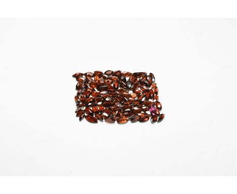 A group of one hundred marquise-cut garnets of a deep red colour, approximately 85 carats in total.  17 grams total, 6-10mm (