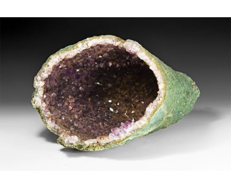 A fine amethyst 'cathedral' geode cave, with richly coloured amethyst crystals layered over rock crystal.  8.13 kg, 38cm deep