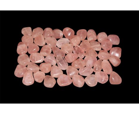 A group of fifty cut and polished rose quartz  1.29 kg total, 32-42mm (1 1/4 - 1 1/2"). From a historic ‘Victorian Museum’ co