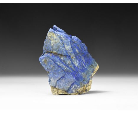 An natural lapis lazuli specimen with cortex.  407 grams, 11cm (4 1/4"). From a historic ‘Victorian Museum’ collection; from 