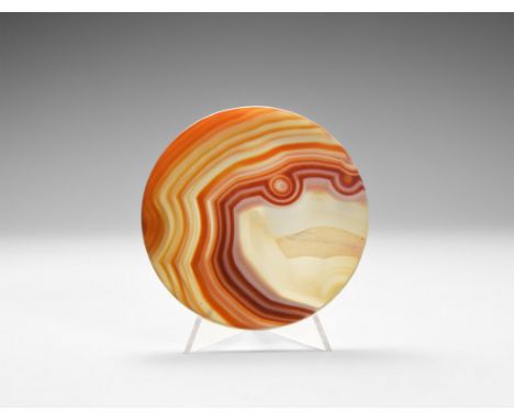 A very fine cut and polished agate coaster with brown, white and orange bands, 'eye' and 'mouth' facing right, possibly colou