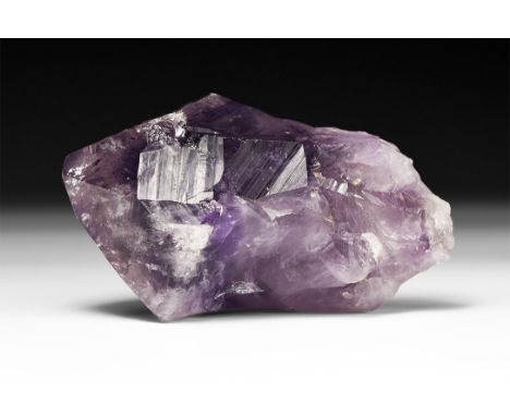 A fine deep purple amethyst crystal specimen, in white card tray with label reading: 'Amethyst, Rio Grande do Sul, Brazil'.  
