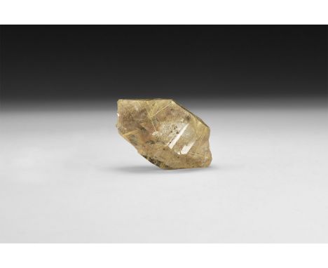 A fine specimen of a rutilated smoked quartz with numerous golden rutile needles in various orientations in white card tray w