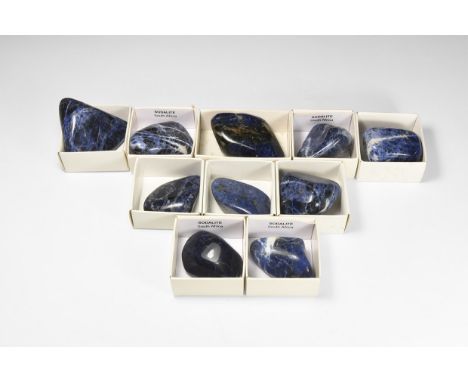 A group of ten purple sodalite specimens with a deep blue colour some with white marbling; each in a card tray.  711 grams to