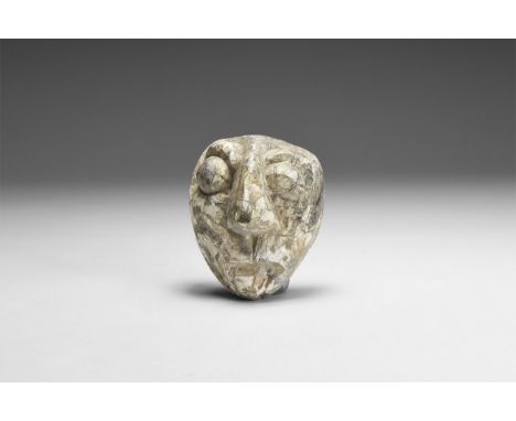 Pliocene Period, 5.2 - 2.5 million years BP. A mastodon fossil tusk carving from the Island of Java.  42 grams, 53mm (2"). Fr