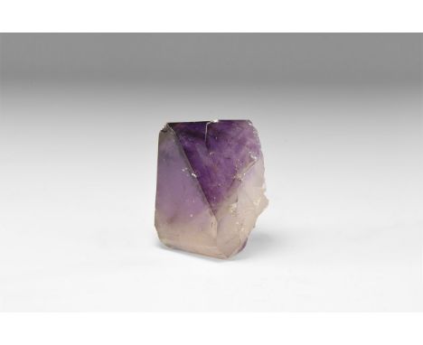A large single amethyst crystal with well formed prism facets and colour graduation from white to dark purple. See Bonewitz, 