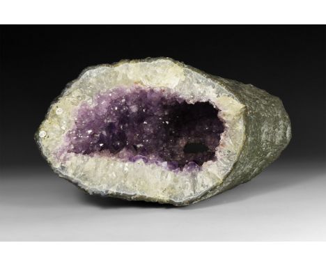 A fine amethyst 'cathedral' geode tunnel, with richly coloured amethyst crystals layered over rock crystal.  8.8 kg, 33cm (13